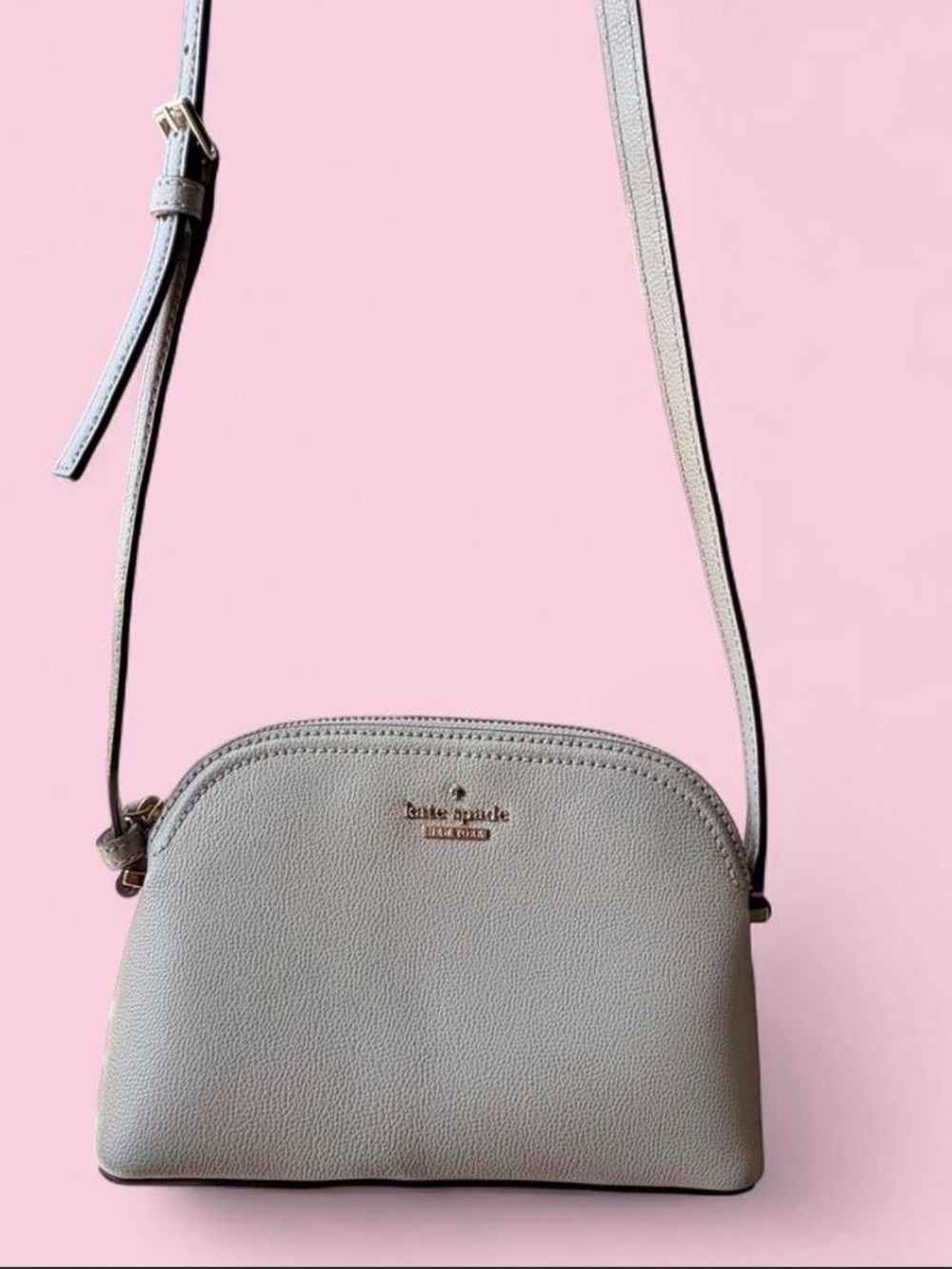 kate spade light gray pebble leather crossbody with gold logo